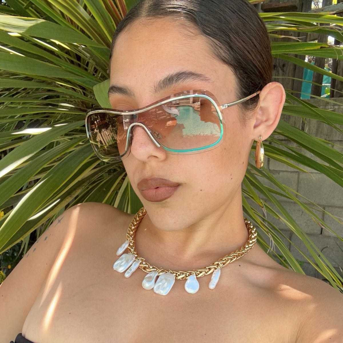 Trendy girl wearing retro sunglasses from Giant Vintage