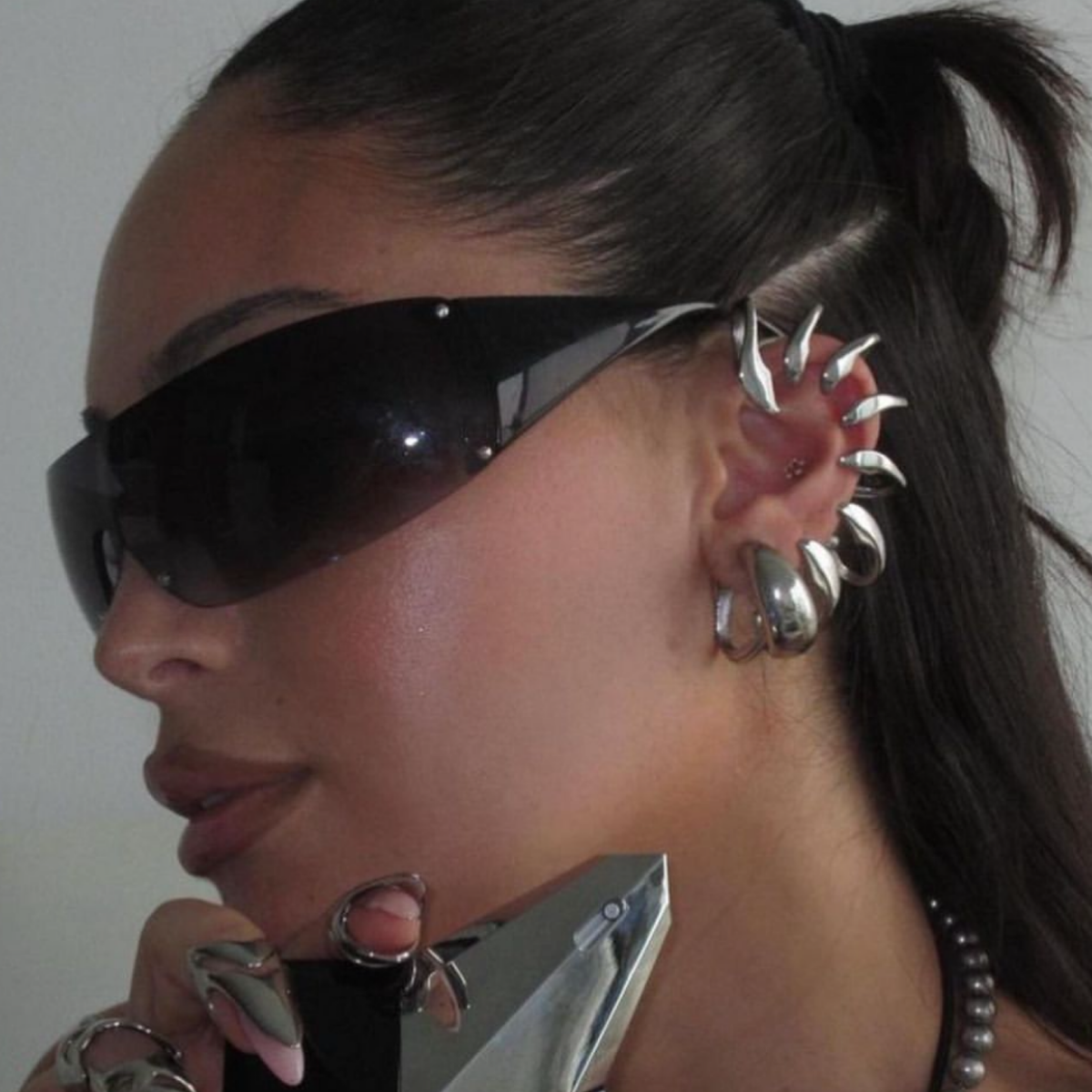 Trendy girl wearing ZIPPER shield sunglasses by Giant Vintage