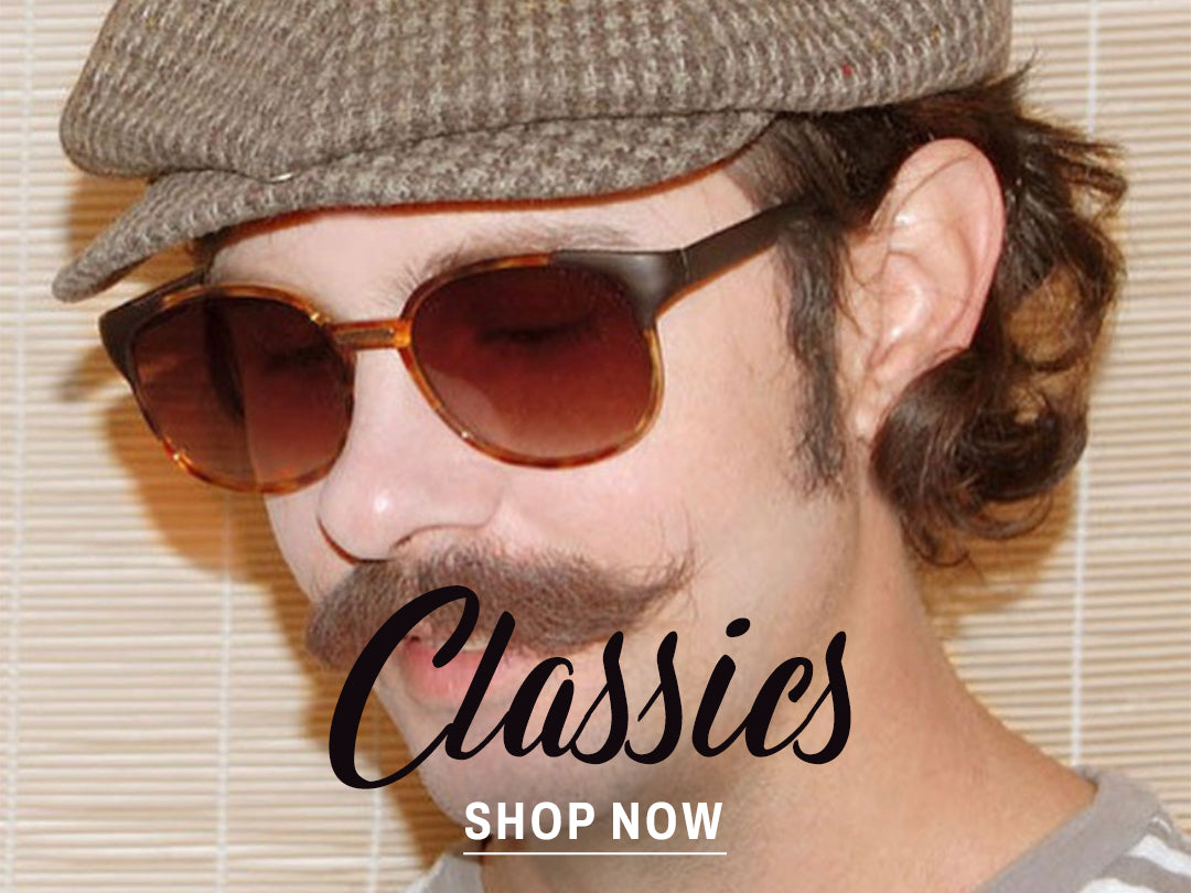 man in classic sunglasses with blue blocker lens 
