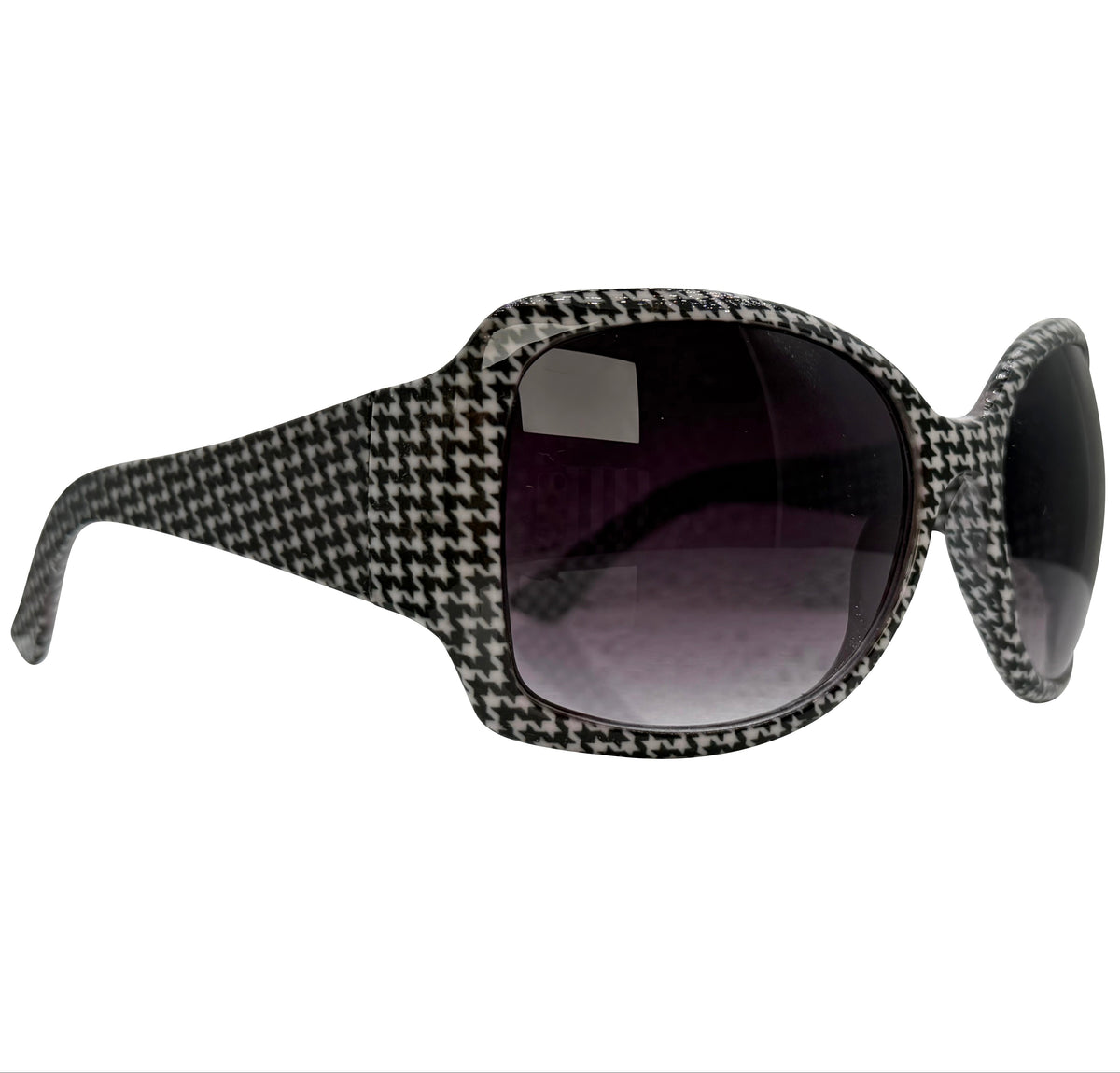 A pair of OXFORD sunglasses with a black and white houndstooth patterned frame and dark tinted lenses, shown from a side profile view on a white background.