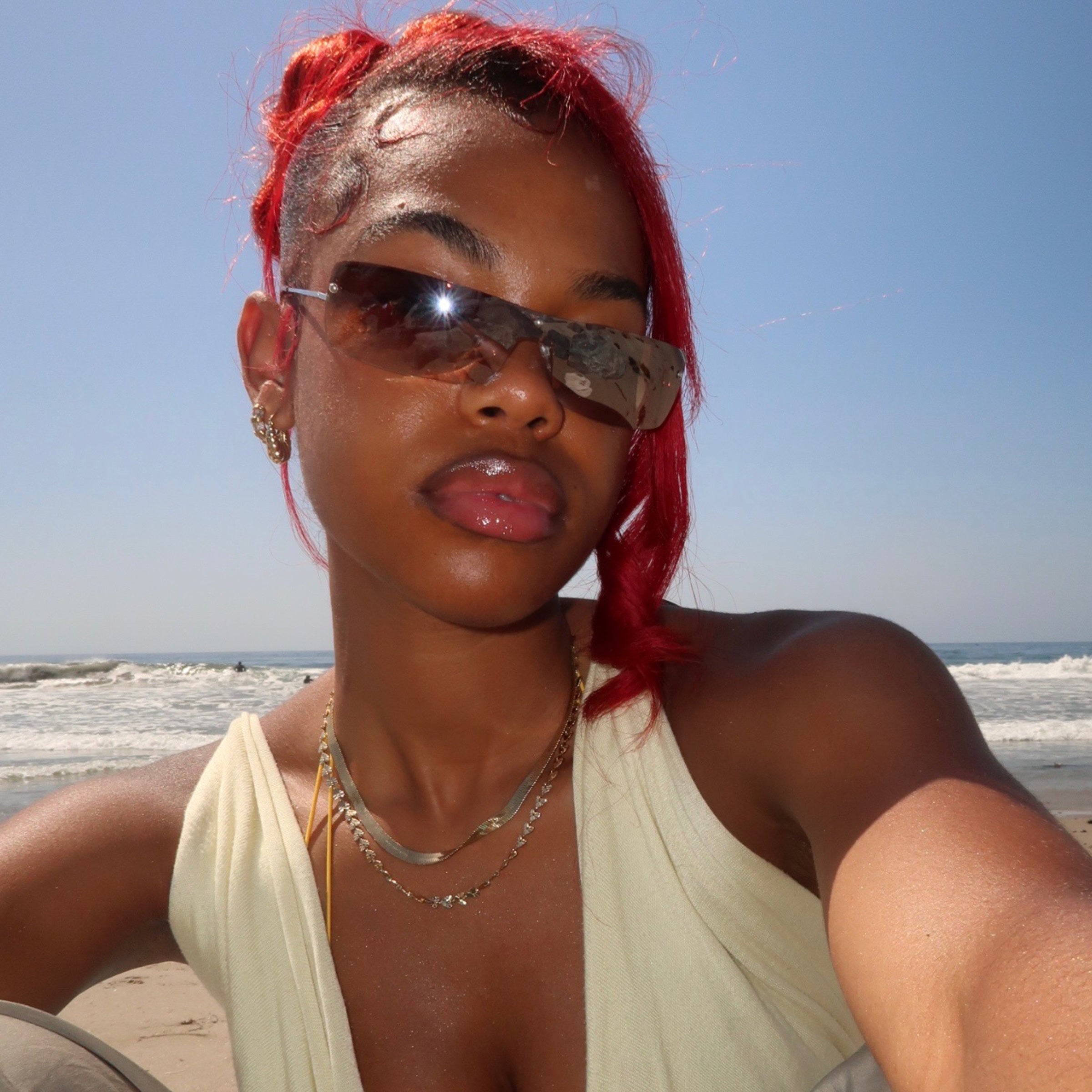model on a beach wearing style called California girl, a rimless shield
