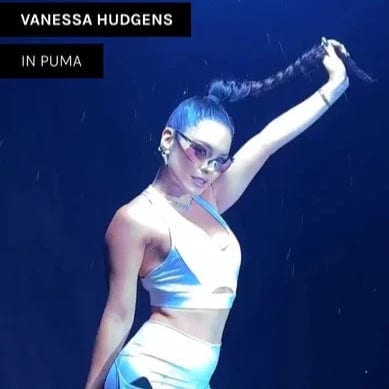 Vanessa Hudgens wearing colorful giant vintage sunglasses shield sunglasses for photo shoot