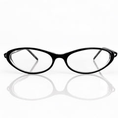 Black BANDAGE eyeglasses with clear lenses, displayed on a reflective white surface against a white background.