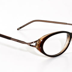 Oval eyeglasses with a BANDAGE espresso frame and thin metal temples, shown on a plain white background.