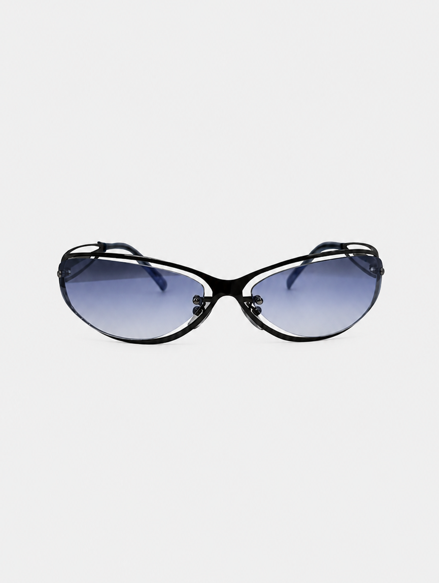 Oversized cat-eye sunglasses with a glossy black frame and gradient blue lenses, shown against a plain light gray background.