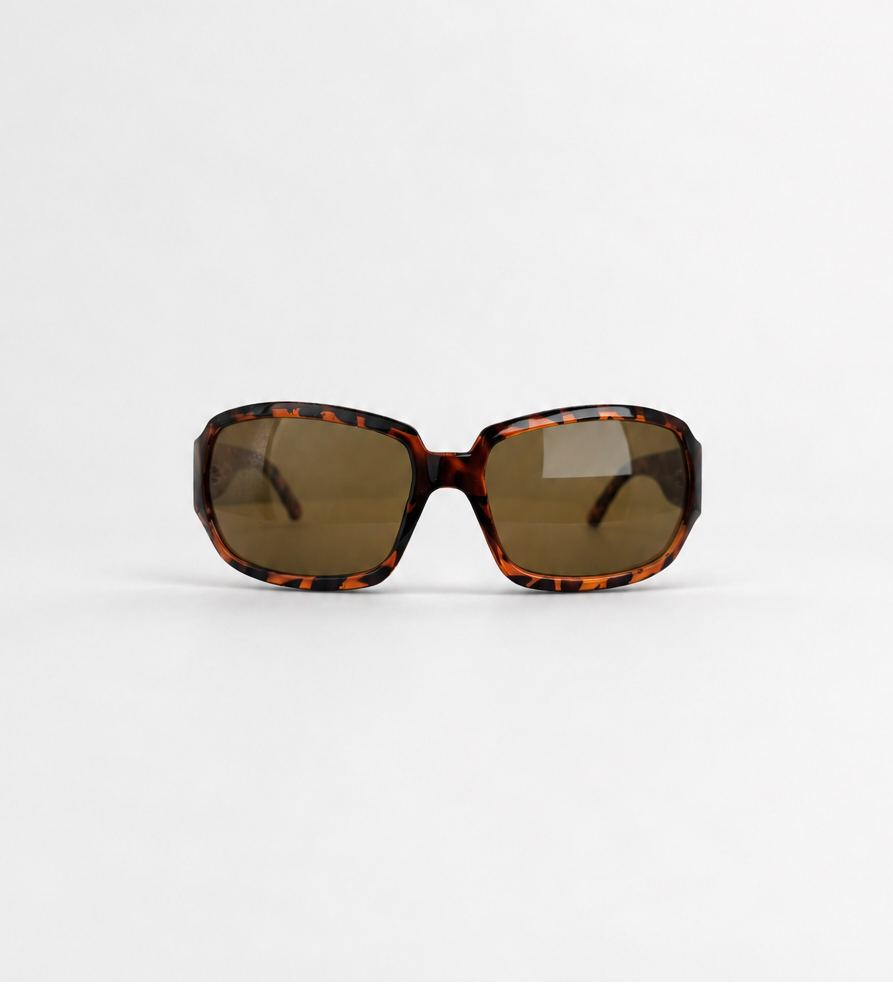 Oversized square sunglasses with a tortoiseshell patterned frame and dark brown lenses, positioned on a clean white background.
