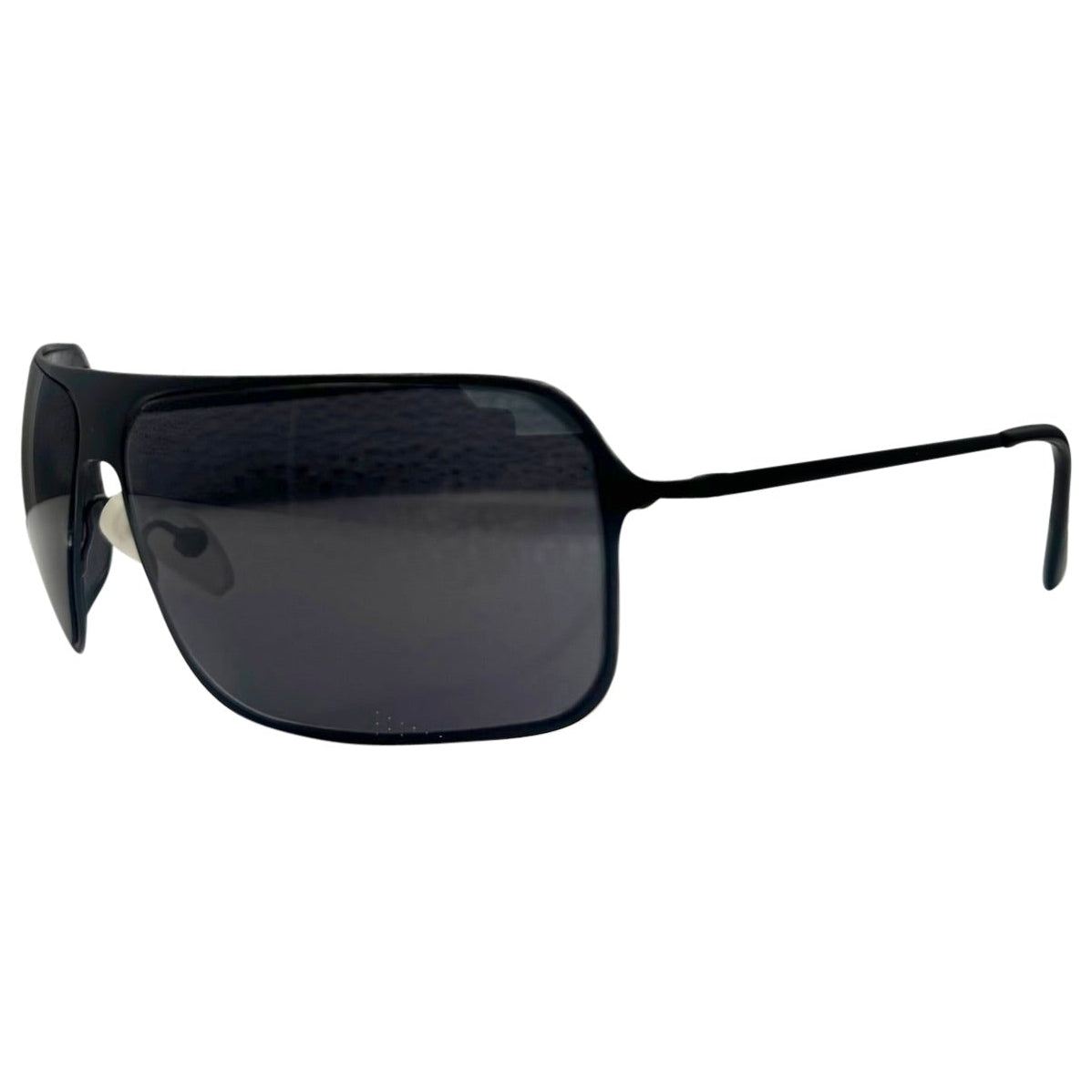 Side profile of EVERYTHING Square Sunglasses in Black Super Dark, showcasing the ultra-slim metal temples, curved wrap-around lens design, and adjustable nose pads.