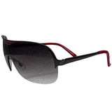 A side-facing product shot of the EXOTIC sunglasses, featuring a rimless shield design with oversized, dark-to-light gradient lenses. The frames are accented by a sleek red double-bridge bar across the top and red arms visible through the lenses.