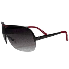A side-facing product shot of the EXOTIC sunglasses, featuring a rimless shield design with oversized, dark-to-light gradient lenses. The frames are accented by a sleek red double-bridge bar across the top and red arms visible through the lenses.