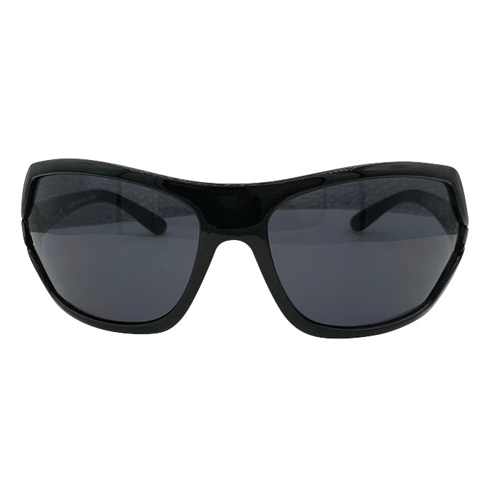 Modern EXOTIC Shield sunglasses with a bold, polished black frame and dark gradient lenses, showcasing an edgy aesthetic.