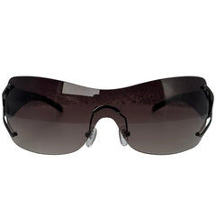 Rimless shield-style sunglasses with a dark brown tinted lens and black frame, shown against a plain white background.