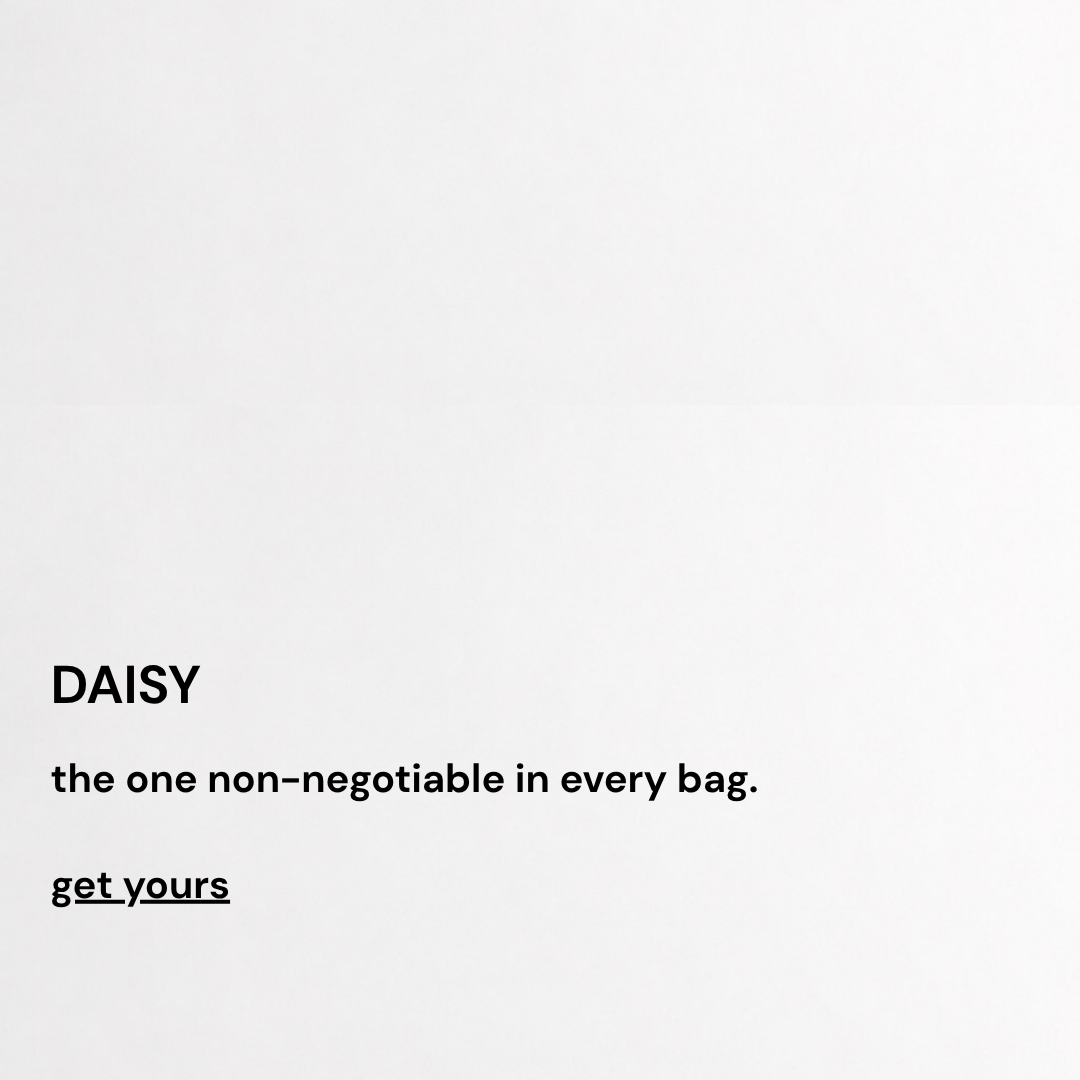 A minimalist white square card or print featuring black text that reads 'DAISY the one non-negotiable in every bag. get yours'.