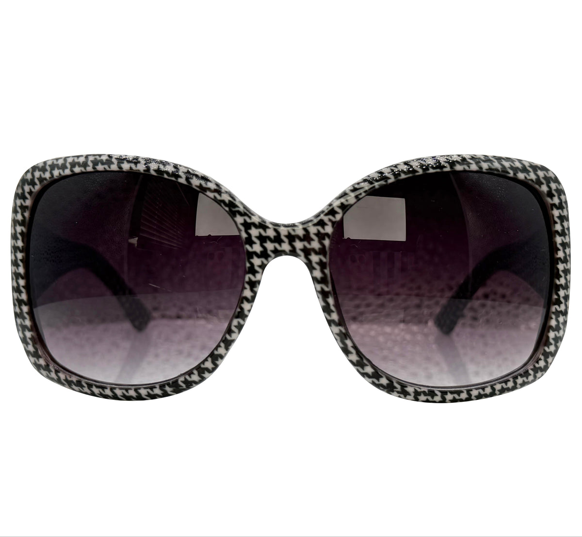 A pair of LANTERN square sunglasses with a black and white houndstooth patterned frame and dark gradient lenses, shown against a plain white background.
