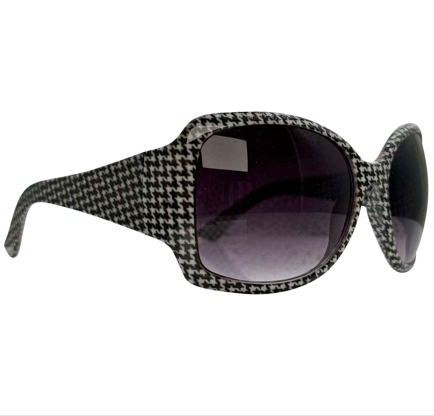 A pair of OXFORD sunglasses with a black and white houndstooth patterned frame and dark tinted lenses, shown from a side profile view on a white background.