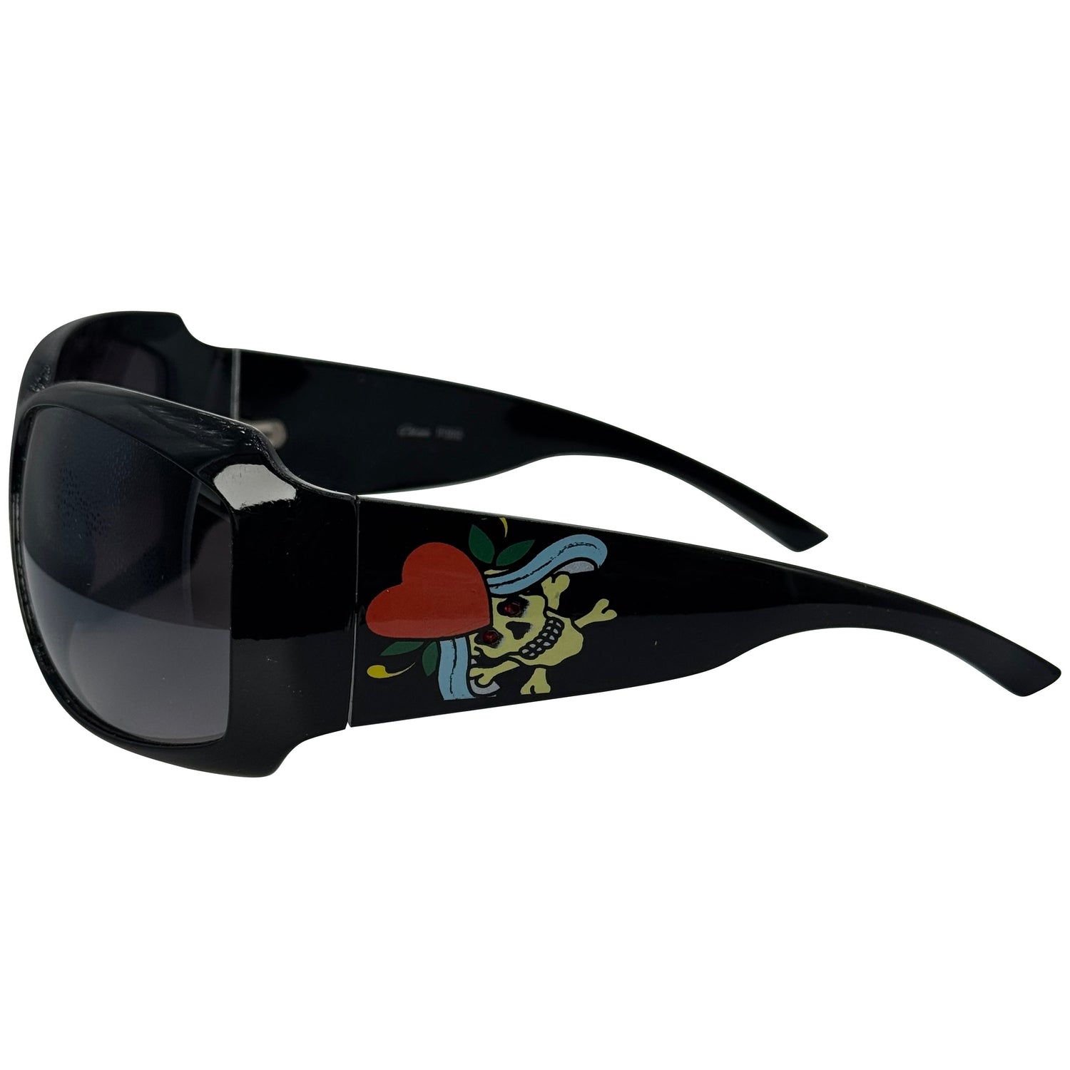 Black wrap-around sunglasses with dark lenses and a colorful skull-and-heart graphic on the temple arm, shown against a plain white background.