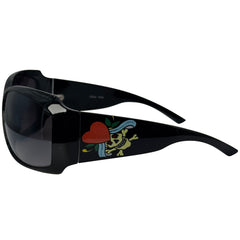 Black wrap-around sunglasses with dark lenses and a colorful skull-and-heart graphic on the temple arm, shown against a plain white background.