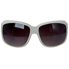 A pair of oversized square sunglasses with a thick, matte light gray frame and dark brown tinted lenses, shown against a plain white background.