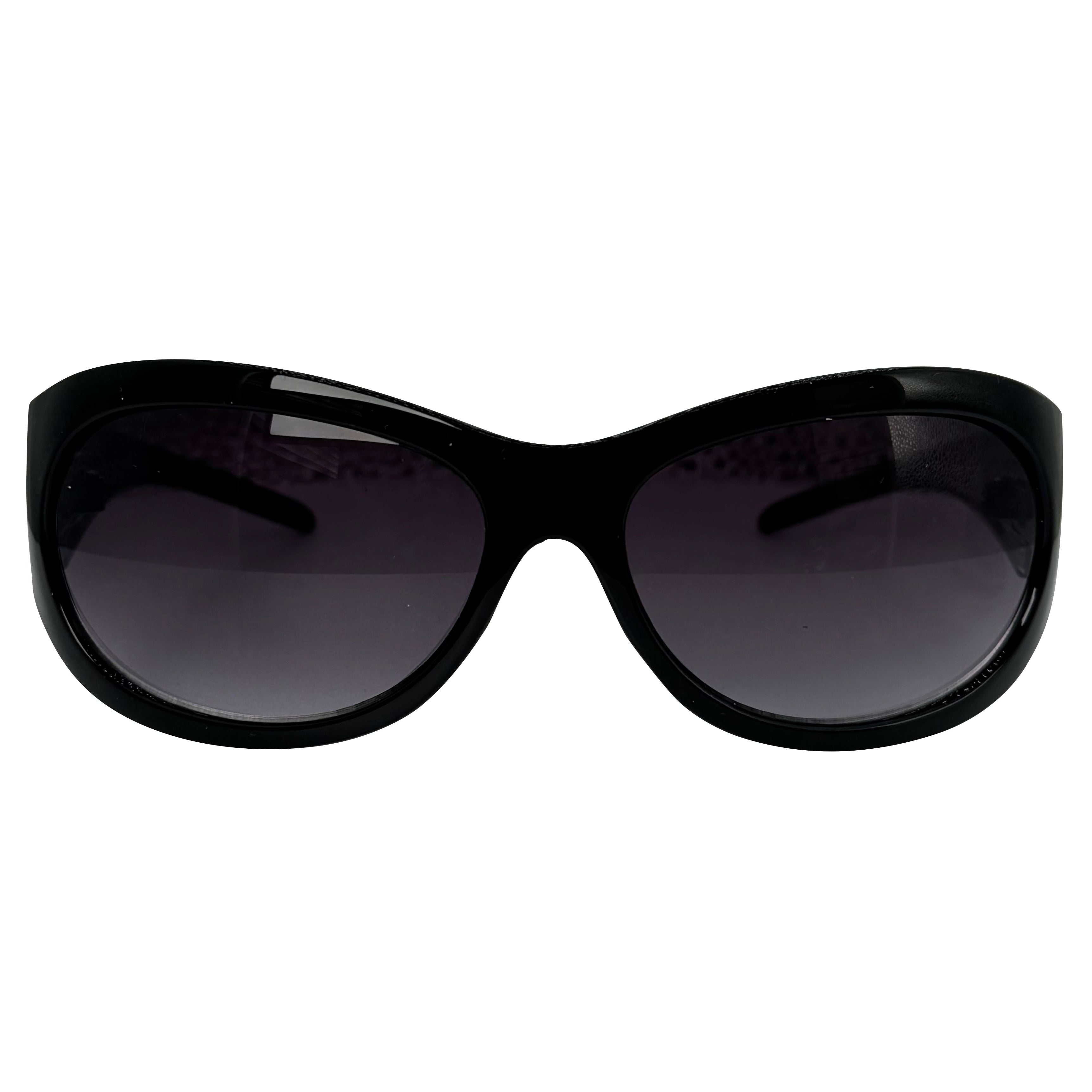 Black cat-eye sunglasses with dark tinted lenses, shown against a plain white background.