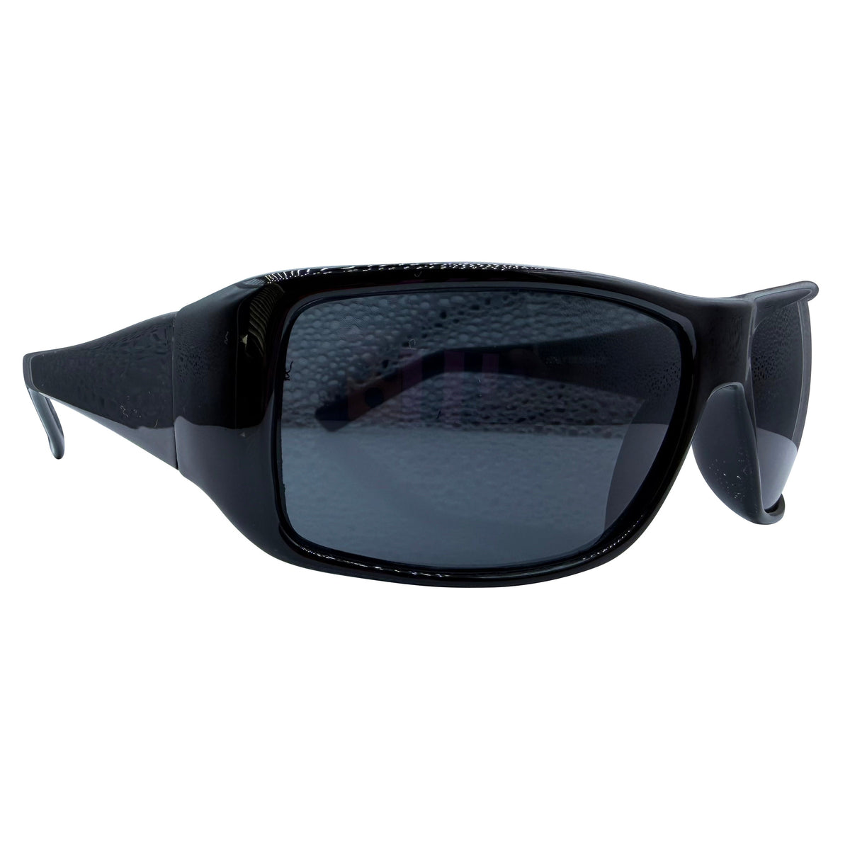 Black MONSTER wrap-around sunglasses with dark-tinted lenses, shown from a side angle on a plain white background.