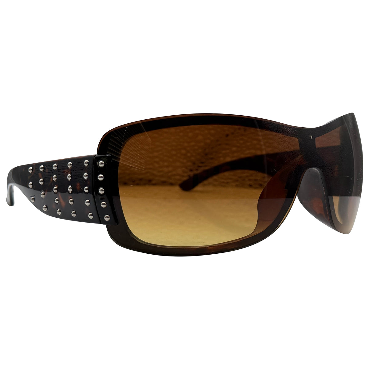 Studded HANNAH wrap-around sunglasses with a black acetate frame, silver studs, and brown gradient lenses, shown on a plain white background.