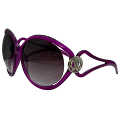 Purple sunglasses with dark tinted lenses and a decorative silver-tone circular embellishment on the temple arm, shown against a plain white background.