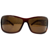 Front view of MYSTERY Shield Sunglasses featuring a translucent amber-brown tortoiseshell frame with oversized, contoured rectangular lenses on a white background.