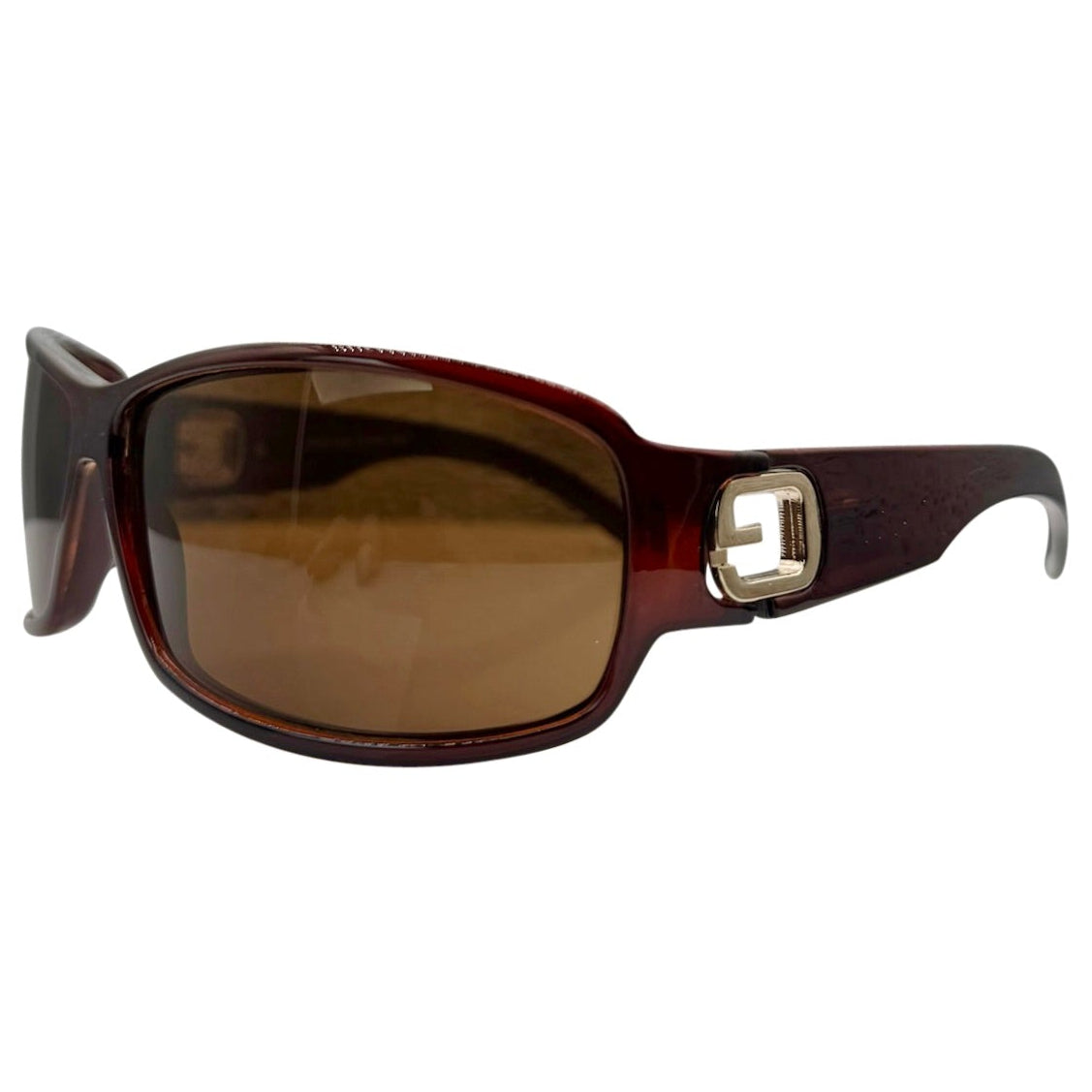 Side profile of MYSTERY Shield Sunglasses in Amber, showcasing the wide, sculpted temples and a distinctive silver-tone geometric metal hinge detail.