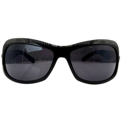 Front view of NICOLE Shield Sunglasses in glossy black featuring a subtle textured pattern along the top brow and solid dark lenses.