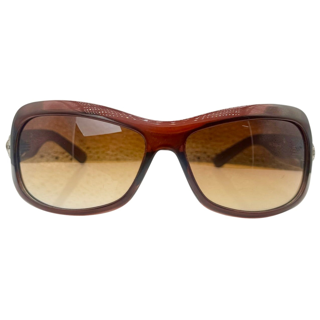 Front view of NICOLE Shield Sunglasses in a translucent brown finish with matching brown gradient lenses.