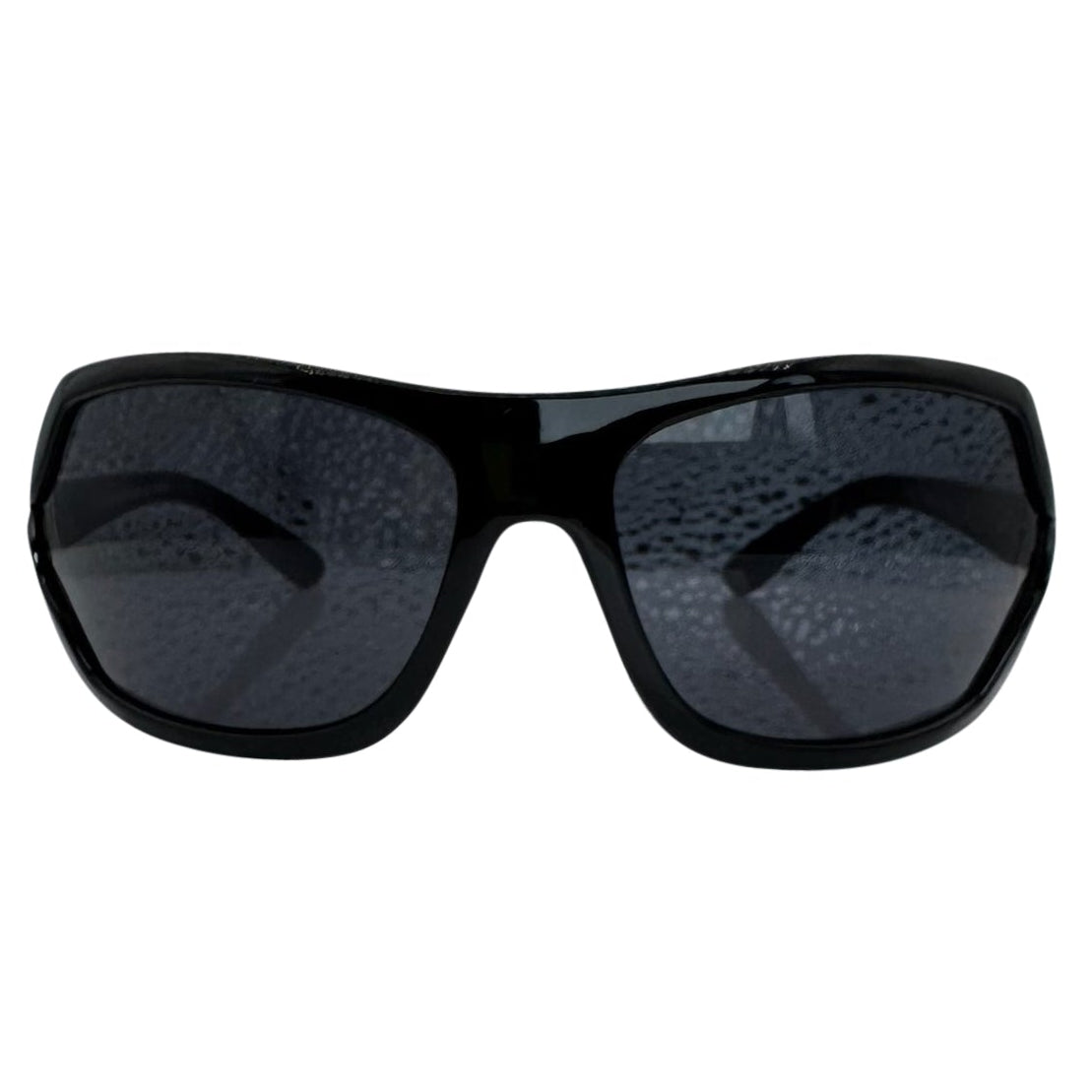 Modern front view of Black EXOTIC Shield sunglasses with a bold, polished black frame and dark gradient lenses, showcasing an edgy aesthetic.