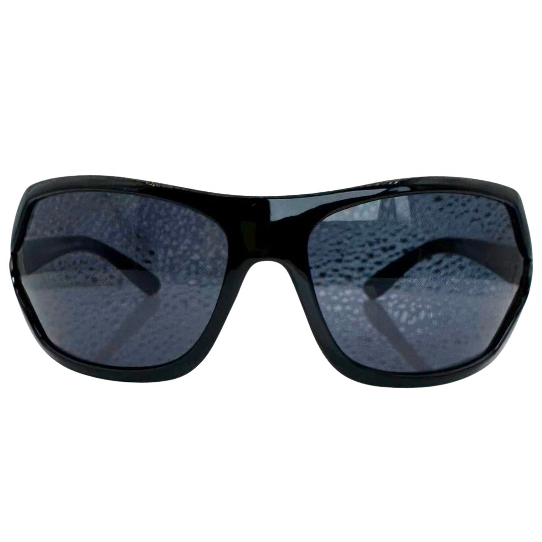 Modern front view of Black EXOTIC Shield sunglasses with a bold, polished black frame and dark gradient lenses, showcasing an edgy aesthetic.