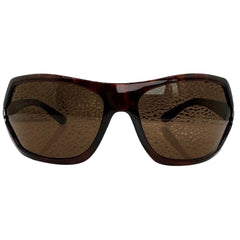 Modern front view of tortoise EXOTIC Shield sunglasses with a bold, polished black frame and dark gradient lenses, showcasing an edgy aesthetic.