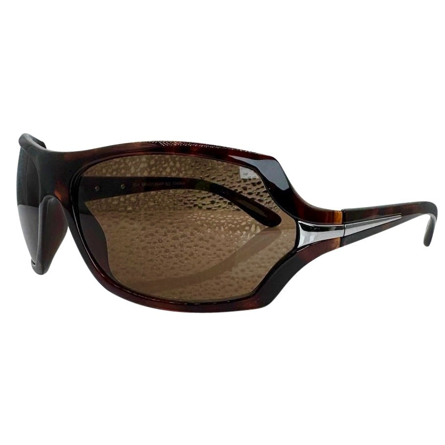 Modern side view of Tortoise EXOTIC Shield sunglasses with a bold, polished black frame and dark gradient lenses, showcasing an edgy aesthetic.