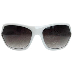 Modern front view of White EXOTIC Shield sunglasses with a bold, polished black frame and dark gradient lenses, showcasing an edgy aesthetic.