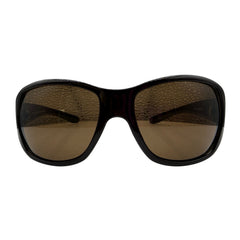 GLITZ AND GLAM oversized sunglasses with a thick black frame and brown tinted lenses, shown against a plain white background.