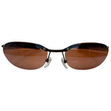 Front-facing view of PERFECT 90s Sunglasses featuring a semi-rimless gunmetal bridge and sleek amber-tinted lenses.