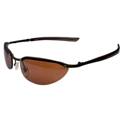 Side profile of PERFECT 90s Sunglasses showing the streamlined gunmetal temples and curved retro amber lenses.