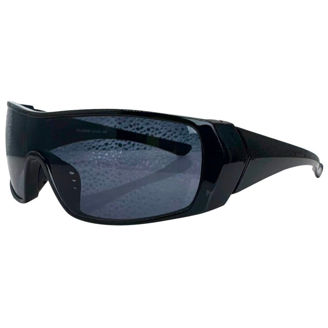 Modern side view of the Black RUNNER shield sunglasses with a sleek matte gunmetal grey frame, showcasing a sharp, industrial silhouette and wide wrap-around shield lenses.