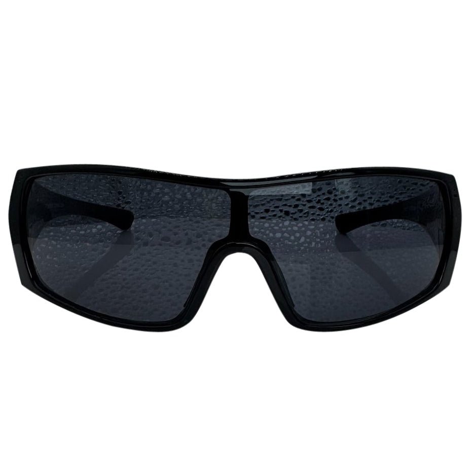 Modern front view of the Black RUNNER shield sunglasses with a sleek matte gunmetal grey frame, showcasing a sharp, industrial silhouette and wide wrap-around shield lenses.