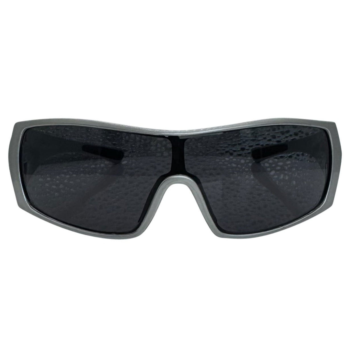Modern front view of the Grey RUNNER shield sunglasses with a sleek matte gunmetal grey frame, showcasing a sharp, industrial silhouette and wide wrap-around shield lenses.