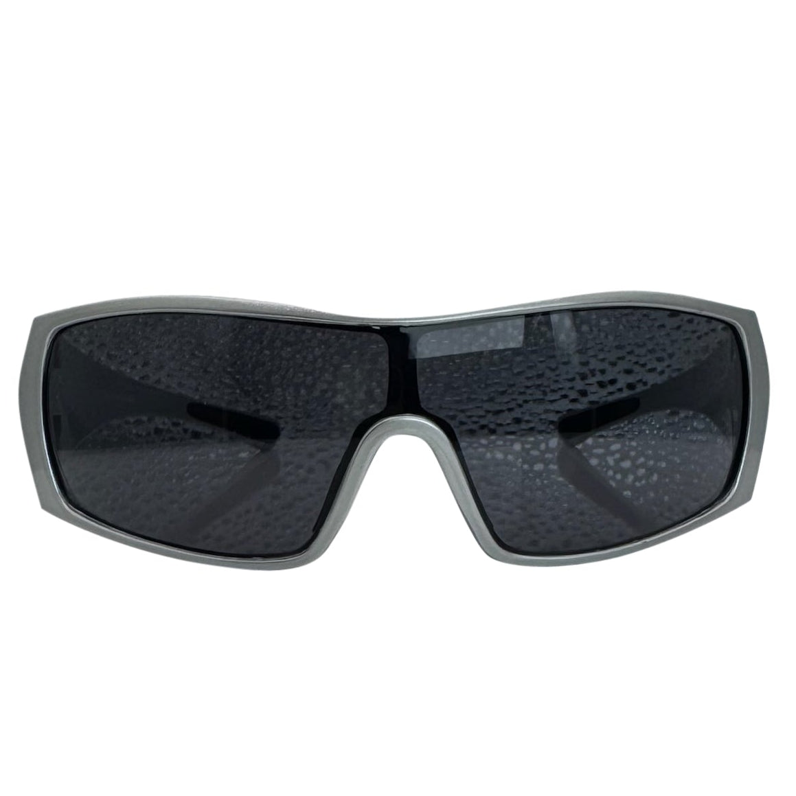 Modern front view of the Grey RUNNER shield sunglasses with a sleek matte gunmetal grey frame, showcasing a sharp, industrial silhouette and wide wrap-around shield lenses.