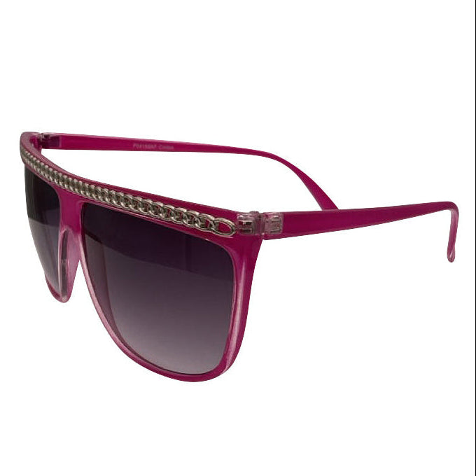Side view of SCANDAL sunglasses showcasing a bright pink oversized shield frame accented with a metallic chain detail and soft gradient lenses for a high-fashion look.