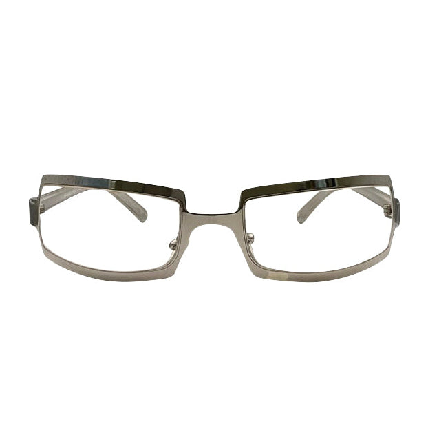 Front view of SHIMMER glasses featuring a high-shine silver metal frame with a unique cutout brow design and clear lenses for a futuristic Y2K look.