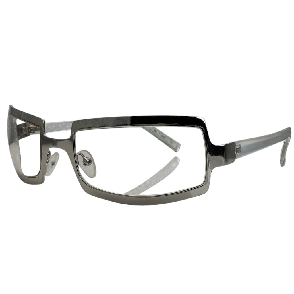 Side view of SHIMMER glasses featuring a high-shine silver metal frame with a unique cutout brow design and clear lenses for a futuristic Y2K look.