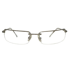 A front-facing view of silver semi-rimless Bayonetta-style glasses featuring slim rectangular lenses and a minimalist metal bridge. The design highlights a sleek top-frame bar that tapers into delicate temples, embodying a modern "office siren" aesthetic.