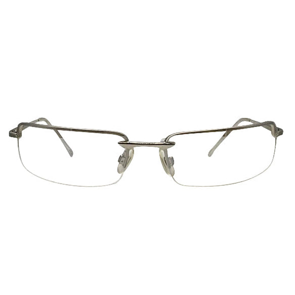 A front-facing view of silver semi-rimless Bayonetta-style glasses featuring slim rectangular lenses and a minimalist metal bridge. The design highlights a sleek top-frame bar that tapers into delicate temples, embodying a modern 