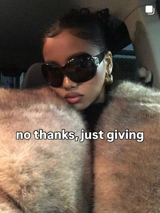 Person wearing sunglasses and a fur coat with text 'no thanks, just giving' inside a vehicle.