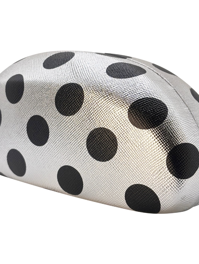 White mesh pouch with black polka dots on a white background