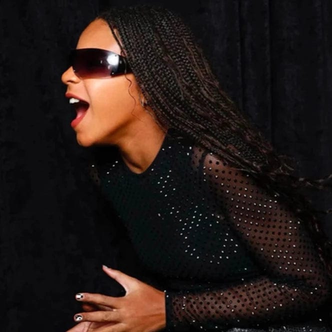 Blue Ivy wearing Giant Vintage zipper shield futuristic sunglasses on tour with mother Beyonce