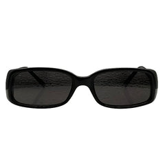 Frontal view of solid black, chunky rectangular sunglasses featuring dark-tinted lenses. The thick acetate frame has a smooth, polished finish with a slightly curved bridge, capturing a bold 90s-inspired minimalist aesthetic.